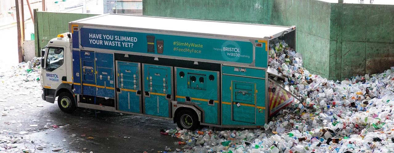 A Bristol waste recycling lorry offloading its contents into the transfer station