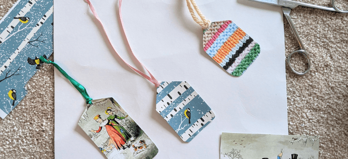 Homemade gift tags made from cardboard and pictures cut out of magazines