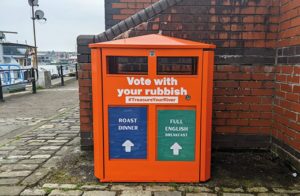 Orange ballot bin with the question roast dinner or full English breakfast