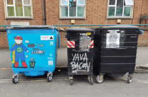 Newly painted blue bin with super hero in St Pauls