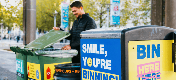 A resident uses one of Bristol's recycling bins