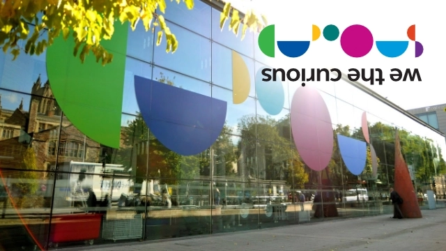 Outside of building with coloured semi circles and We The Curious Logo