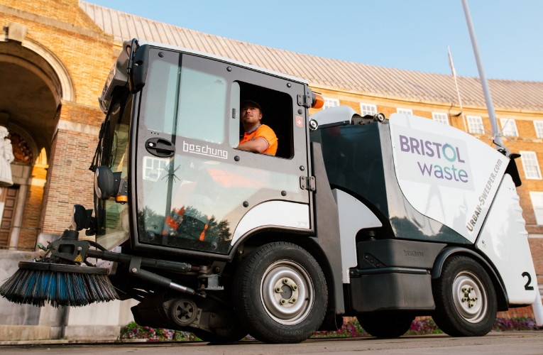 Man inside electrical sweeper