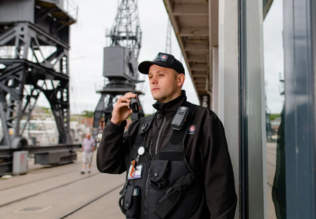 Security guard standing outside a building