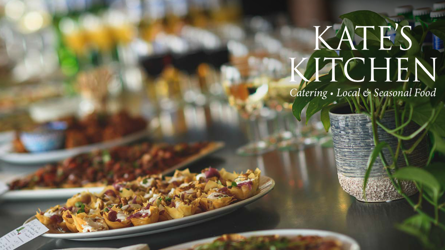A plate with food and a logo that says Kate's Kitchen