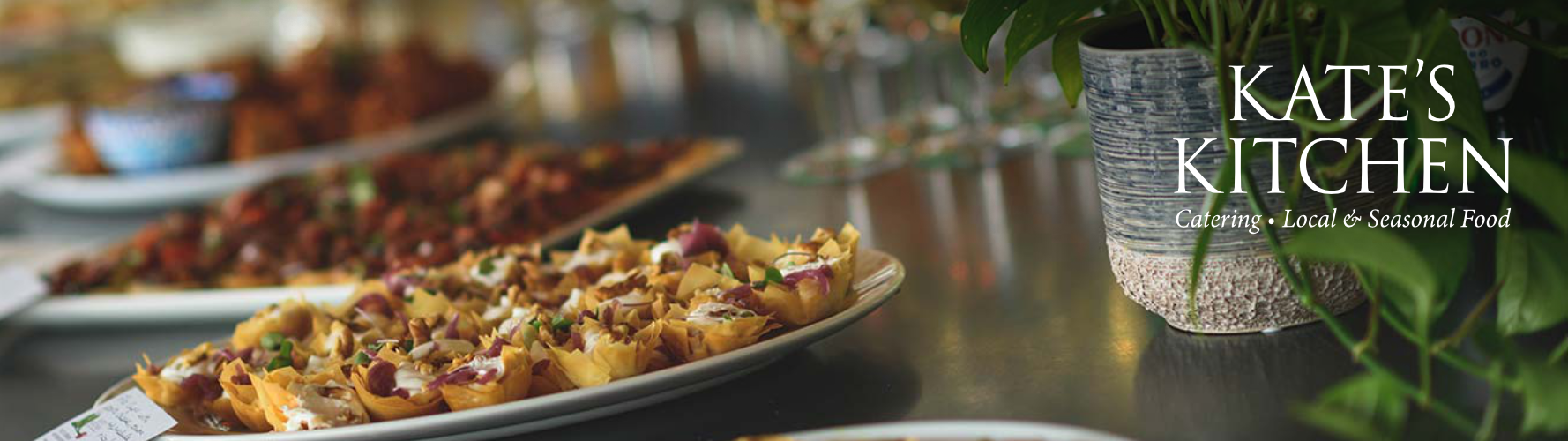 A plate with food and a logo that says Kate's Kitchen