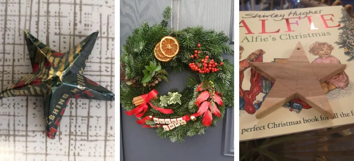 A star made out of paper, a Christmas wreath and a star made of wood