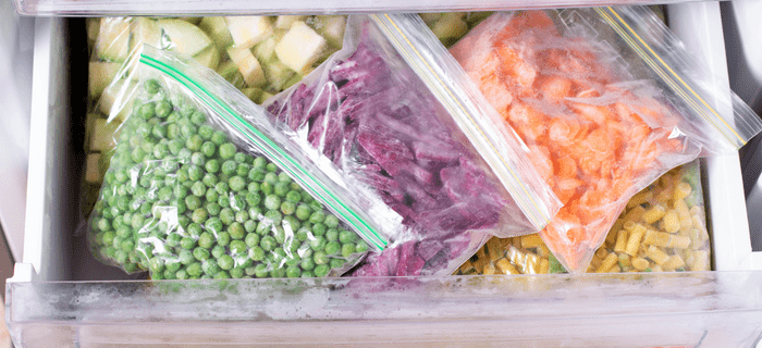 Bags of vegetables in a freezer