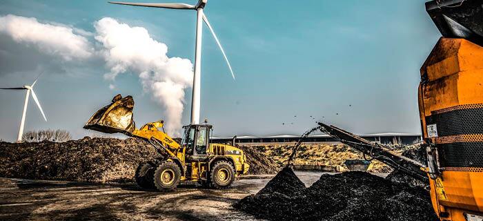 Two tractors shredding organic waste