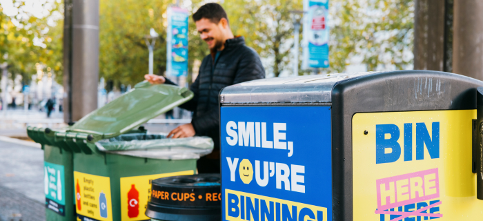 A resident uses one of Bristol's recycling bins