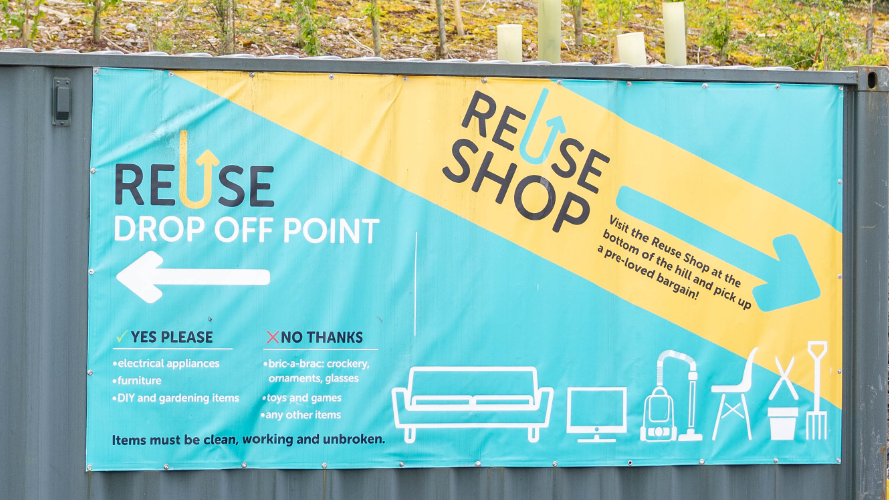 Container with Reuse shop donation banner
