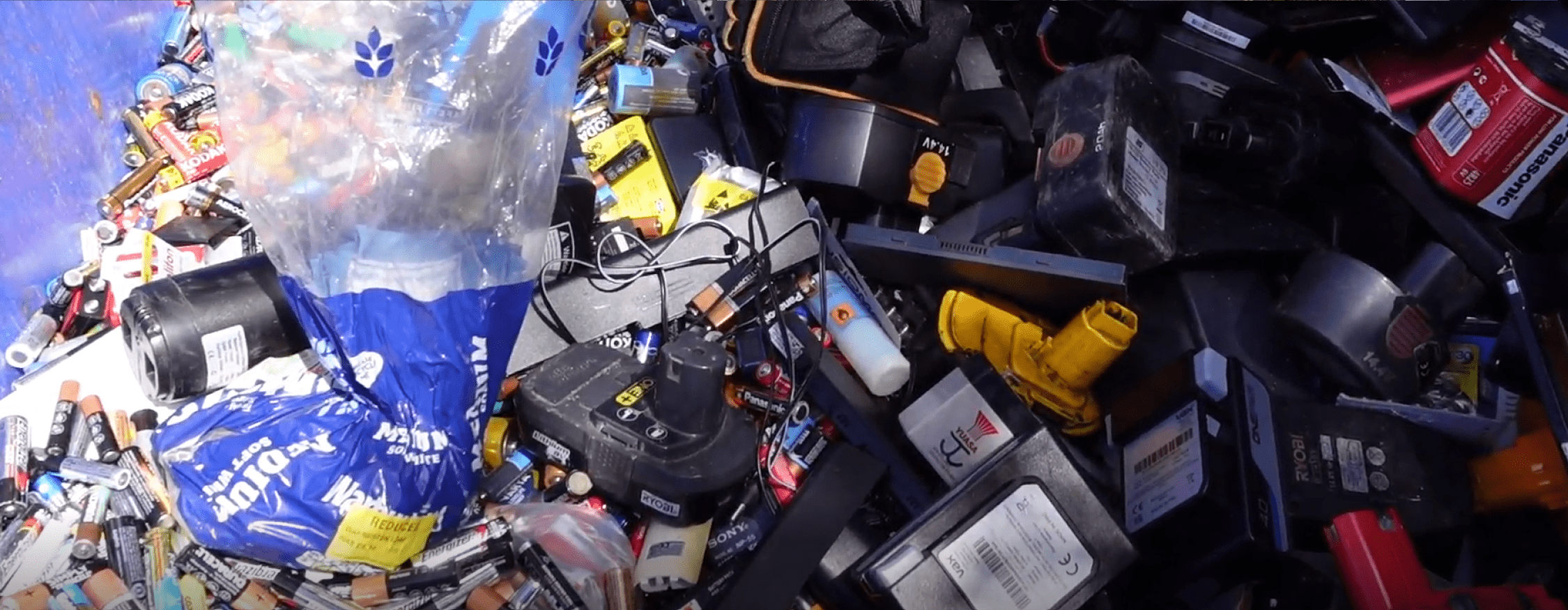 Batteries of all kinds and sizes, from AAs to large batteries from e-scooters, are in a container at the recycling centre