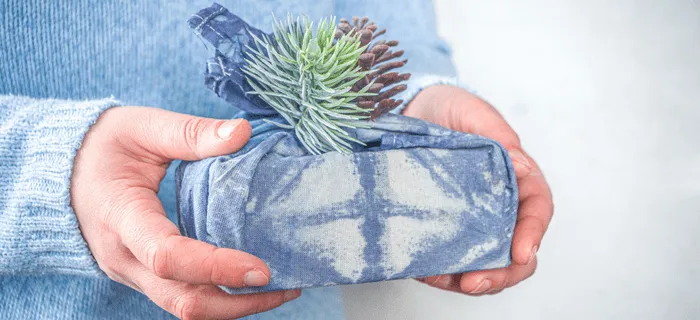 A present wrapped up in blue fabric