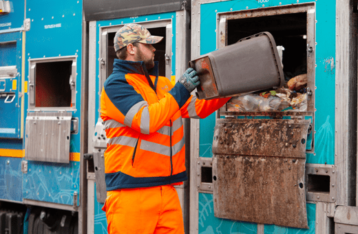 Food waste from a brown household bin is tipped into the Bristol Waste truck to be recycled