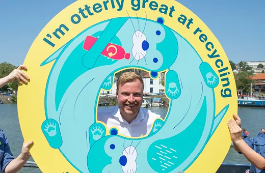 Kye Dudd smiling inside a In The Loop cardboard cut-out