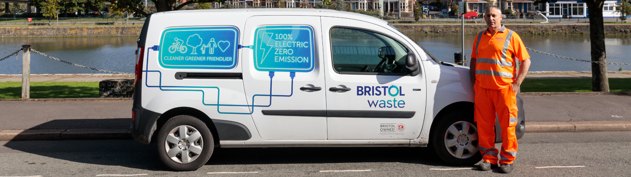 Bristol Waste employee standing next to an electric van