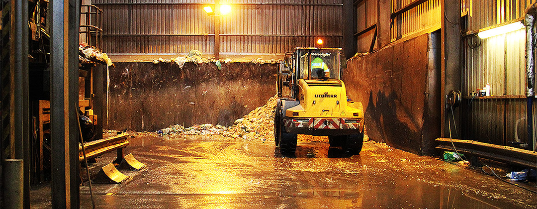 A vehicle collecting food waste from a warehouse at GENeco