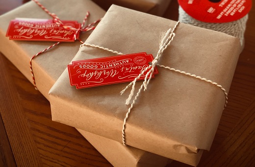 Presents wrapped in brown paper and reused gift tags
