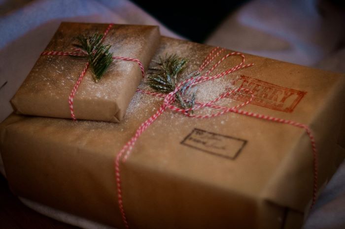 Christmas presents wrapped with brown paper and string