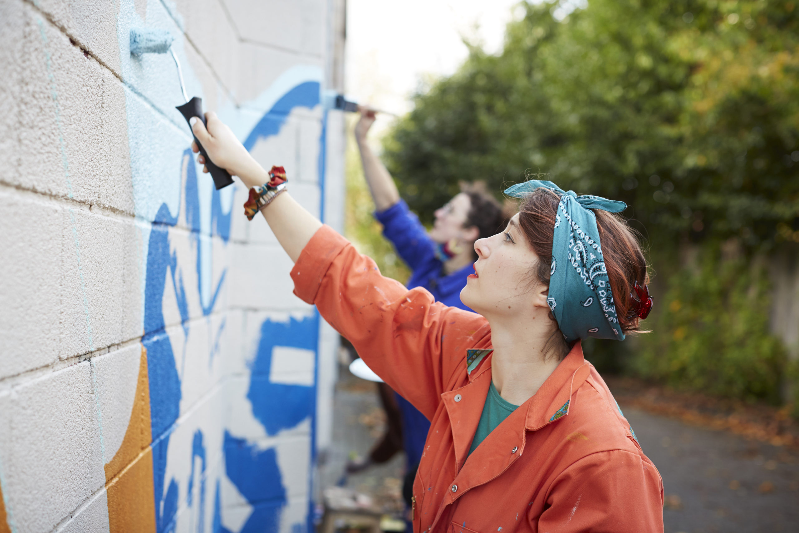 Artist Jenny Simmons painting the walls of Easton Leisure Centre