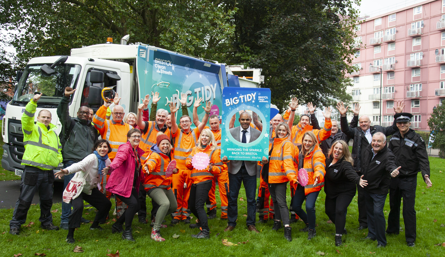 A group of Bristol Waste and Bristol City Council members, including Mayor Marvin Rees, pose in front of a Big Tidy street cleaning vehicle.