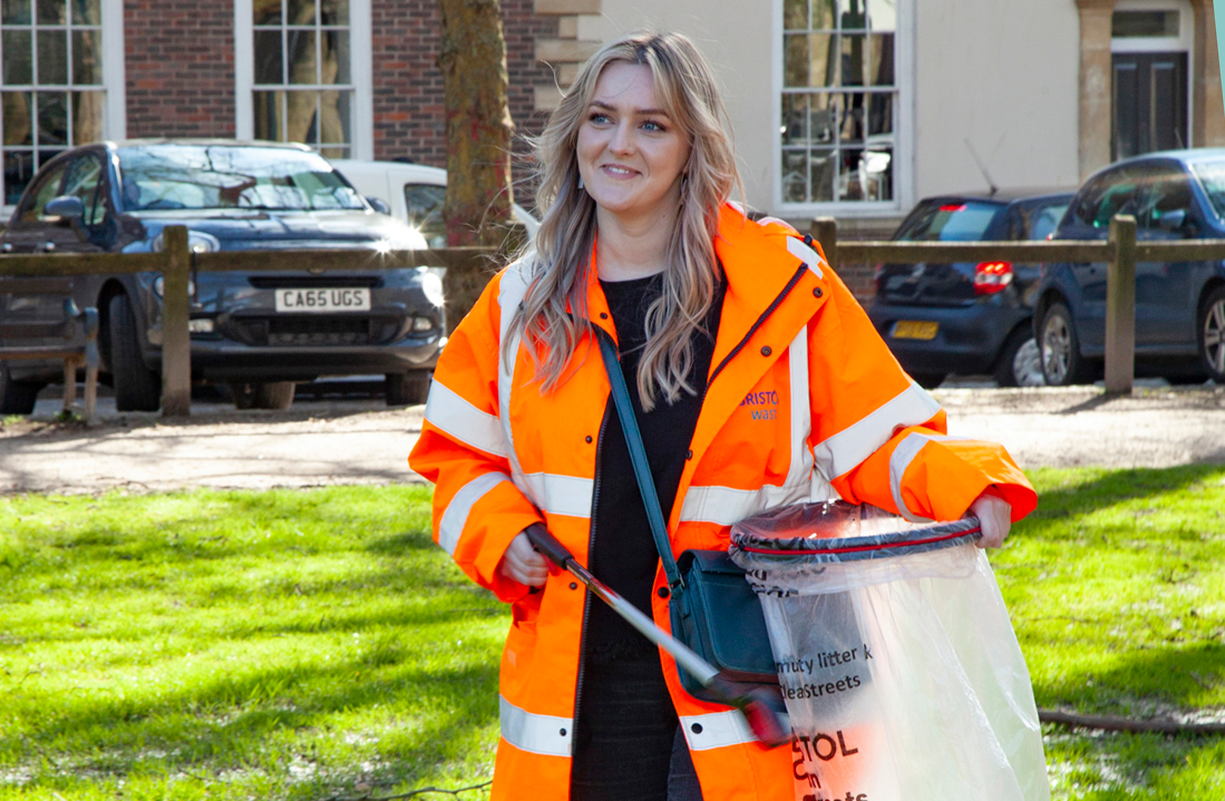 Bristol Waste community engagement officer Hanna holding a litter picker and a litter bag