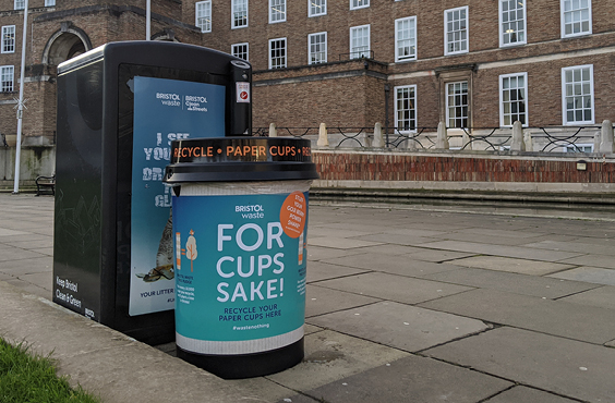 A cup bin in front of Bristol's City Hall