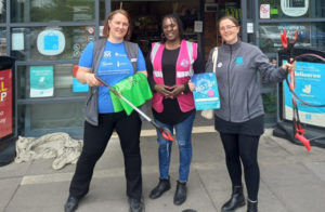 Coop team making the Big Tidy Pledge outside a store