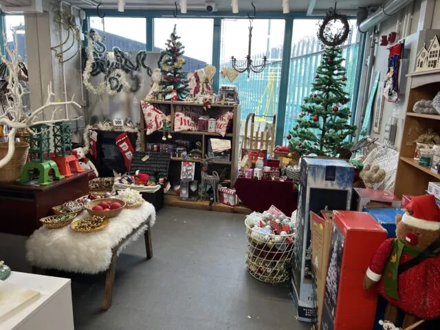 A Christmas display at the Bristol Waste Reuse Shop, including Christmas trees, toys and decorations