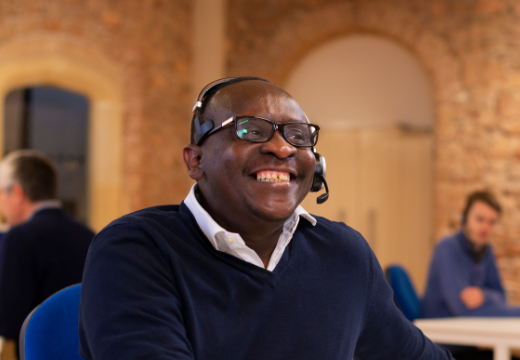 Man wearing headset smiling
