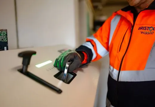 Hand destroying hard drive