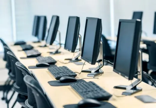 Computer monitors and keyboards and chairs