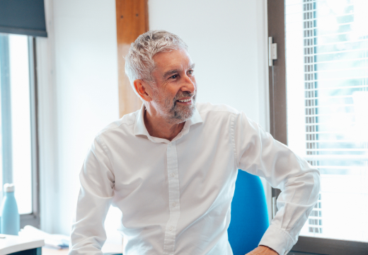 Man wearing white shirt smiling