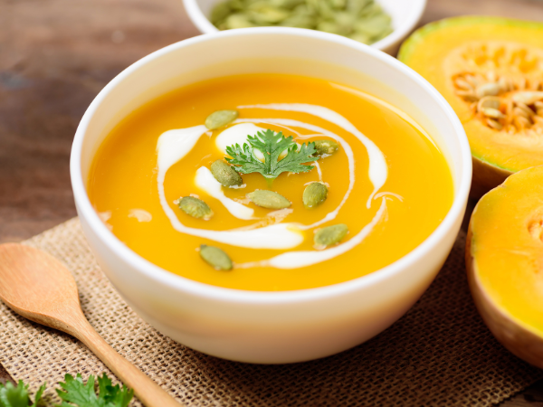 One of the low-waste recipes: A bowl of orange soup, topped with pumpkin seeds