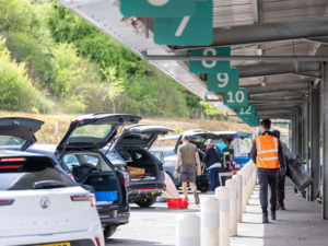 A recycling centre in Bristol is busy with people dropping off different materials to be recycled