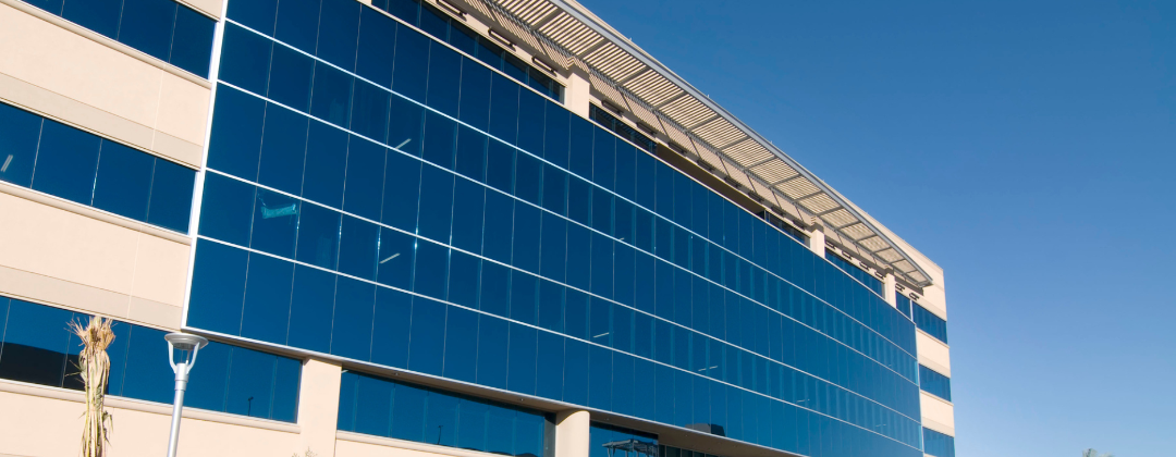 Blog: FM mistakes that increase your carbon footprint image shows the external windows of an Office building
