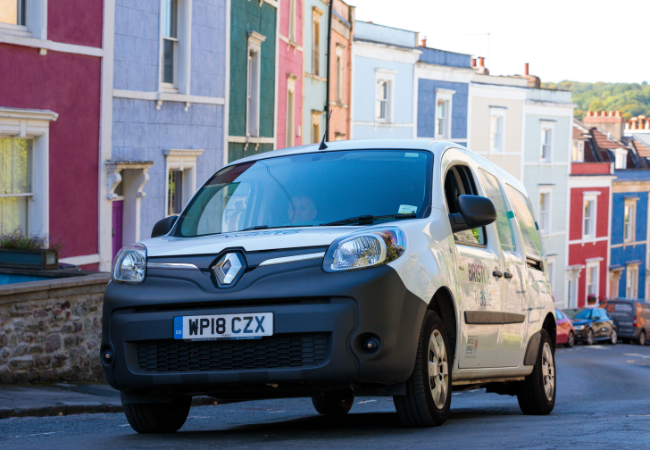 Bristol Waste van driving along street with colourful houses - bristol waste's facilities services in Bristol