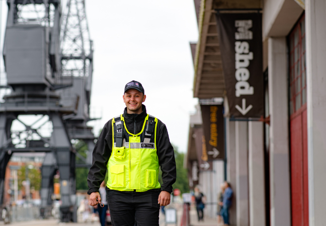 Security guard walking outside M Shed building - Bristol Waste's facilities services in bristol