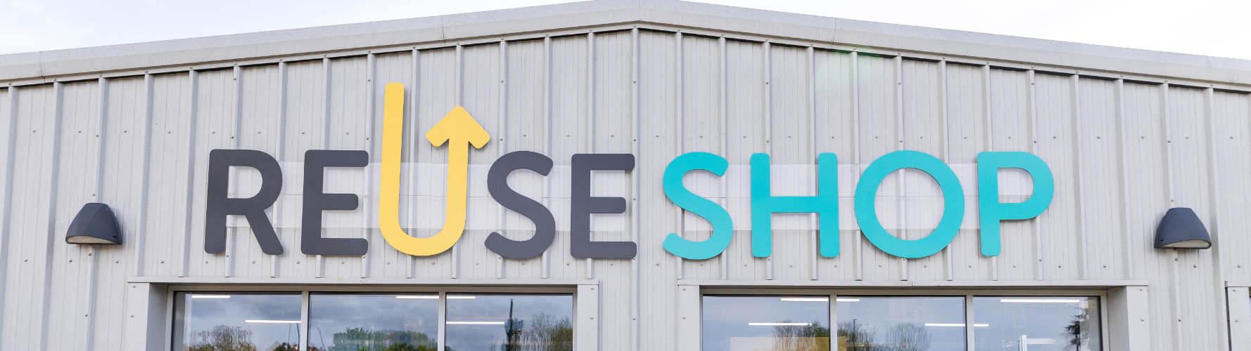 Reuse Shop letters on a warehouse building