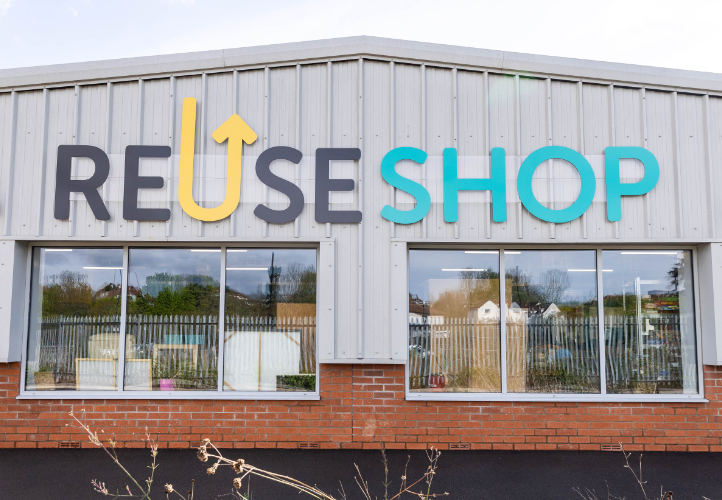 Warehouse building with Reuse Shop sign attached to it
