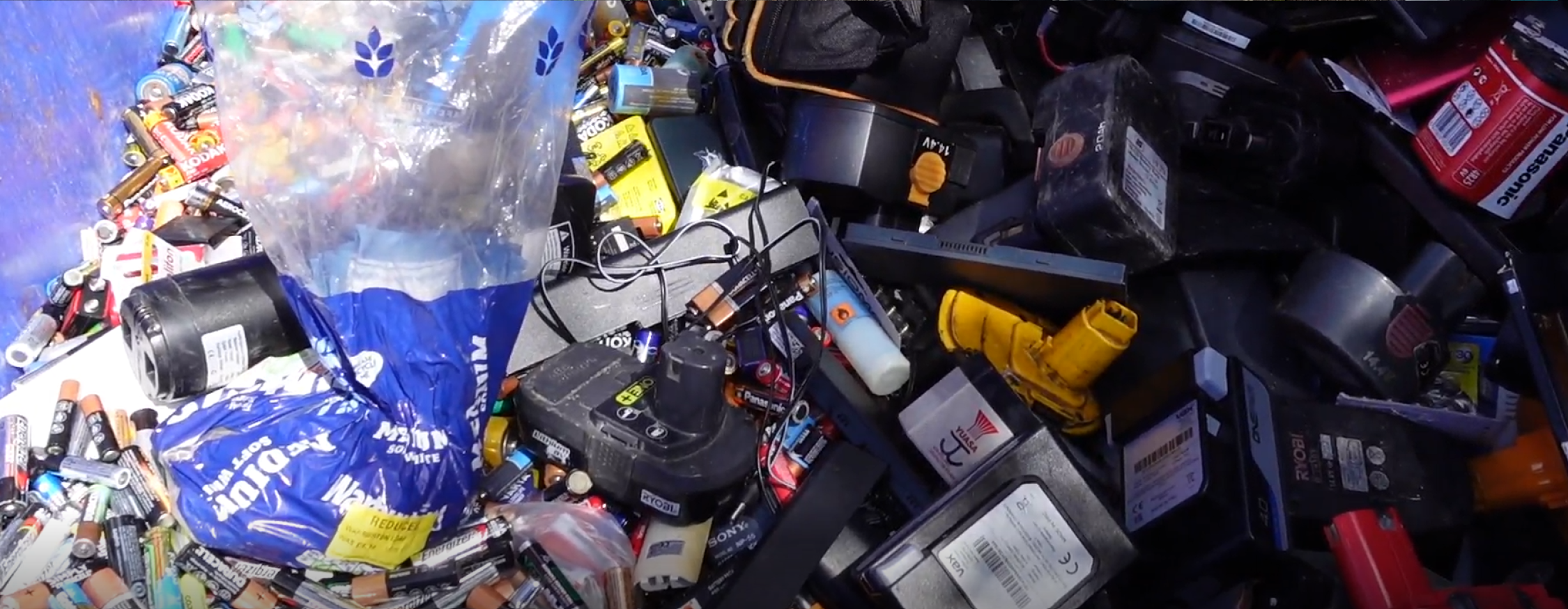Batteries of all kinds and sizes, from AAs to large batteries from e-scooters, are in a container at the recycling centre