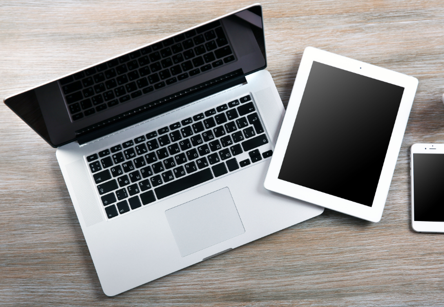 A Laptop, ipad and mobile phone, ready for computer recycling